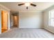 Large bedroom with neutral walls, carpet flooring, base trim, and natural light at 109 Priestwood Ln, Acworth, GA 30102