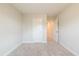 Empty bedroom featuring neutral walls, white base trim, and carpet flooring at 109 Priestwood Ln, Acworth, GA 30102