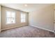 Bright bedroom with two large windows that offer plenty of natural light and plush carpeting at 109 Priestwood Ln, Acworth, GA 30102