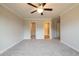 Spacious bedroom featuring neutral walls, ceiling fan, carpet flooring, and walk-in closets at 109 Priestwood Ln, Acworth, GA 30102