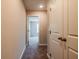 Hallway featuring carpet flooring, doors to adjacent rooms, and a closet at 109 Priestwood Ln, Acworth, GA 30102