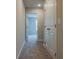 Upstairs hallway with neutral walls, carpet flooring, and closet at 109 Priestwood Ln, Acworth, GA 30102