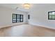 Bright bedroom featuring hardwood floors, recessed lighting, and large windows providing natural light at 3968 Ashford Dunwoody, Brookhaven, GA 30319