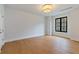 Bright bedroom with hardwood floors, recessed lighting, and large windows offering natural light at 3968 Ashford Dunwoody, Brookhaven, GA 30319