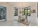 Breakfast nook with a glass table and chairs set, surrounded by large windows providing ample natural light at 3968 Ashford Dunwoody, Brookhaven, GA 30319