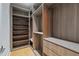 Walk-in closet with custom wood shelving, drawers, and ample hanging space for organized storage at 3968 Ashford Dunwoody, Brookhaven, GA 30319