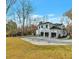 Three-car garage exterior featuring a well-manicured lawn and spacious driveway, all on a sunny day at 3968 Ashford Dunwoody, Brookhaven, GA 30319