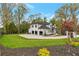 Exterior angle of three-car garage featuring a well-manicured lawn and spacious driveway at 3968 Ashford Dunwoody, Brookhaven, GA 30319