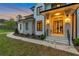 Gorgeous front entrance featuring modern black framed windows, minimalist landscaping, and striking wall sconces at 3968 Ashford Dunwoody, Brookhaven, GA 30319