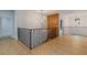 Hallway with wood floors, black railings and decorative lighting at 3968 Ashford Dunwoody, Brookhaven, GA 30319