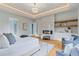 Bright main bedroom featuring a modern fireplace and light tray ceiling at 3968 Ashford Dunwoody, Brookhaven, GA 30319