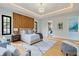 Main bedroom with wood accent wall, neutral colors and tray ceiling at 3968 Ashford Dunwoody, Brookhaven, GA 30319