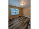 A bedroom features modern flooring and a window at 5104 Fairington Village Dr # 5104, Lithonia, GA 30038