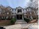 Three story building with brick and vinyl siding and black shutters at 5104 Fairington Village Dr # 5104, Lithonia, GA 30038