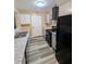 The kitchen has granite counters and new appliances at 5104 Fairington Village Dr # 5104, Lithonia, GA 30038