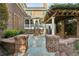 Backyard patio featuring a brick terrace, pergola, and access to a screened porch at 2039 Fisher Ne Trl, Atlanta, GA 30345