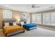 This bedroom features neutral walls, two beds, lots of light, and a ceiling fan at 2039 Fisher Ne Trl, Atlanta, GA 30345