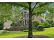 Charming brick home with a manicured lawn, mature trees, and inviting front entrance at 2039 Fisher Ne Trl, Atlanta, GA 30345