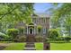 Beautiful two-story brick home with mature landscaping, manicured lawn, and inviting entryway at 2039 Fisher Ne Trl, Atlanta, GA 30345