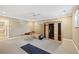 Spacious fitness room with workout equipment, sauna, and neutral carpet at 2039 Fisher Ne Trl, Atlanta, GA 30345