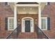 Inviting entryway with black door, white trim, and arched transom window under house number 2039 at 2039 Fisher Ne Trl, Atlanta, GA 30345