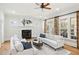 Cozy living room with fireplace, neutral decor, and an abundance of natural light at 2039 Fisher Ne Trl, Atlanta, GA 30345