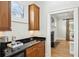Convenient wet bar area with wooden cabinets, sink, and elegant countertop at 2039 Fisher Ne Trl, Atlanta, GA 30345