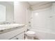 Well-lit bathroom featuring granite counter, a bathtub, and modern fixtures at 2534 Grayton Loop, Villa Rica, GA 30180