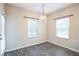 Bright dining room with hardwood floors and modern chandelier, perfect for meals and entertaining at 2534 Grayton Loop, Villa Rica, GA 30180