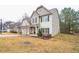 Charming two-story home featuring a well-manicured lawn, traditional siding, and an inviting front entrance at 2534 Grayton Loop, Villa Rica, GA 30180