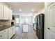 Modern kitchen with white cabinetry, stainless steel appliances, granite countertops and center island at 2534 Grayton Loop, Villa Rica, GA 30180