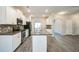 Modern kitchen with white cabinetry, stainless steel appliances, granite countertops and center island at 2534 Grayton Loop, Villa Rica, GA 30180