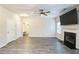 Spacious living room with fireplace, ceiling fan, and hardwood flooring for a modern and comfortable atmosphere at 2534 Grayton Loop, Villa Rica, GA 30180