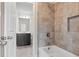 Bathroom showcasing a tub with tile surround, built-in niche, and a view into the bathroom at 4325 Bellview Ln, Duluth, GA 30097