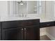 Modern bathroom vanity with marble countertop and dark wood cabinetry at 4325 Bellview Ln, Duluth, GA 30097