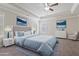 Staged bedroom with tray ceiling, carpet, two windows, and art at 4325 Bellview Ln, Duluth, GA 30097