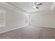 Expansive bedroom featuring carpet flooring, a ceiling fan, and natural light at 4325 Bellview Ln, Duluth, GA 30097