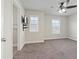 Carpeted bedroom with natural light, ceiling fan, and closet at 4325 Bellview Ln, Duluth, GA 30097