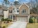 Traditional two-story brick home with a two-car garage, neat landscaping, and a welcoming front entrance at 4325 Bellview Ln, Duluth, GA 30097