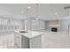 Spacious living area featuring a kitchen island, modern fireplace, and plenty of natural light from large windows at 4325 Bellview Ln, Duluth, GA 30097