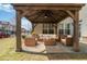 Staged covered patio area featuring comfortable seating and stylish decor at 4325 Bellview Ln, Duluth, GA 30097