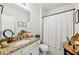 Bathroom featuring granite counters, vanity, and shower with tub at 5225 Tye Trl, Fairburn, GA 30213