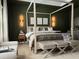 A lovely bedroom with stylish furniture and unique lighting at 5225 Tye Trl, Fairburn, GA 30213