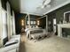 Spacious main bedroom features a decorative fireplace and four-poster bed at 5225 Tye Trl, Fairburn, GA 30213