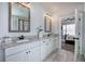 Bathroom featuring double vanity, granite countertop, and mirrors at 64 Roberson Ne Dr, Cartersville, GA 30121