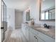 Well-lit bathroom featuring double vanity, granite countertop, and glass shower at 64 Roberson Ne Dr, Cartersville, GA 30121