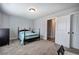 Cozy bedroom featuring carpet, a bed, ceiling fan, and dresser, creating a comfortable and stylish space at 64 Roberson Ne Dr, Cartersville, GA 30121