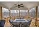 Outdoor seating area with a covered roof and a view of the surrounding trees and neighborhood at 64 Roberson Ne Dr, Cartersville, GA 30121