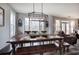 Dining room with large wooden table, rustic chandelier, and lots of natural light at 64 Roberson Ne Dr, Cartersville, GA 30121