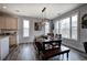 Charming dining area featuring a rustic table, modern lighting, and views of the outdoors at 64 Roberson Ne Dr, Cartersville, GA 30121